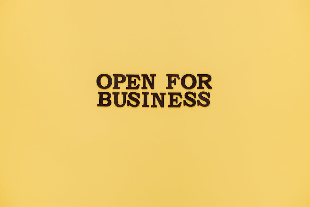 Bold 'Open for Business' text on a vibrant yellow background for advertising.